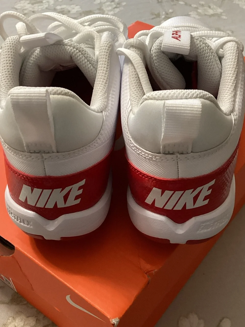 Nike Kids White and Red Alpha Lace-Up Football Cleats 🏈